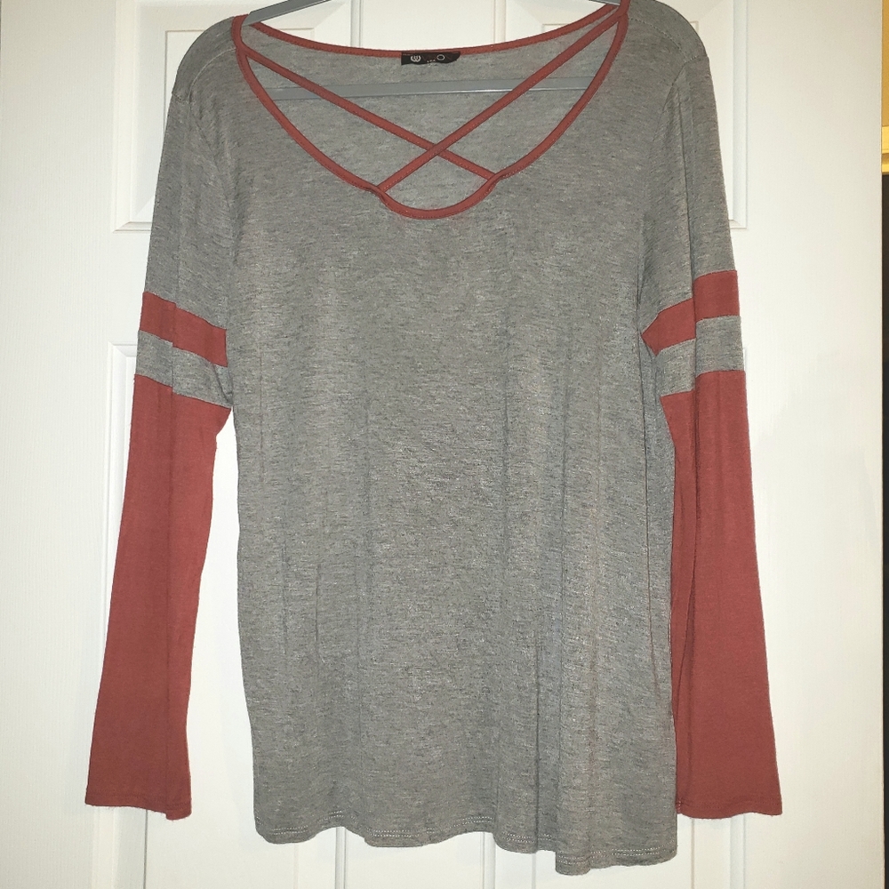 Vision criss cross neckline long sleeve shirt.